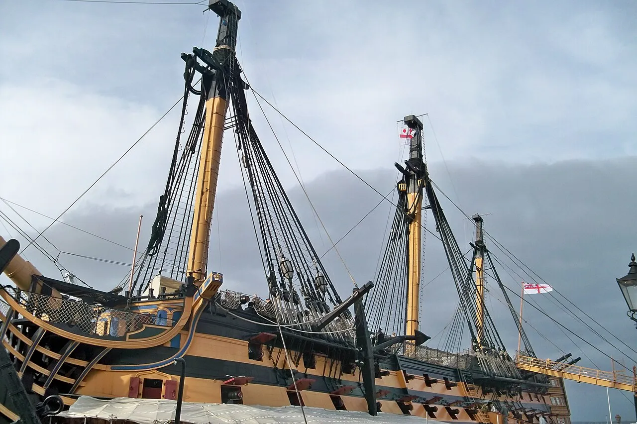 HMS Victory in dry dock at Portsmouth Historic Dockyard, seen from the quayside.