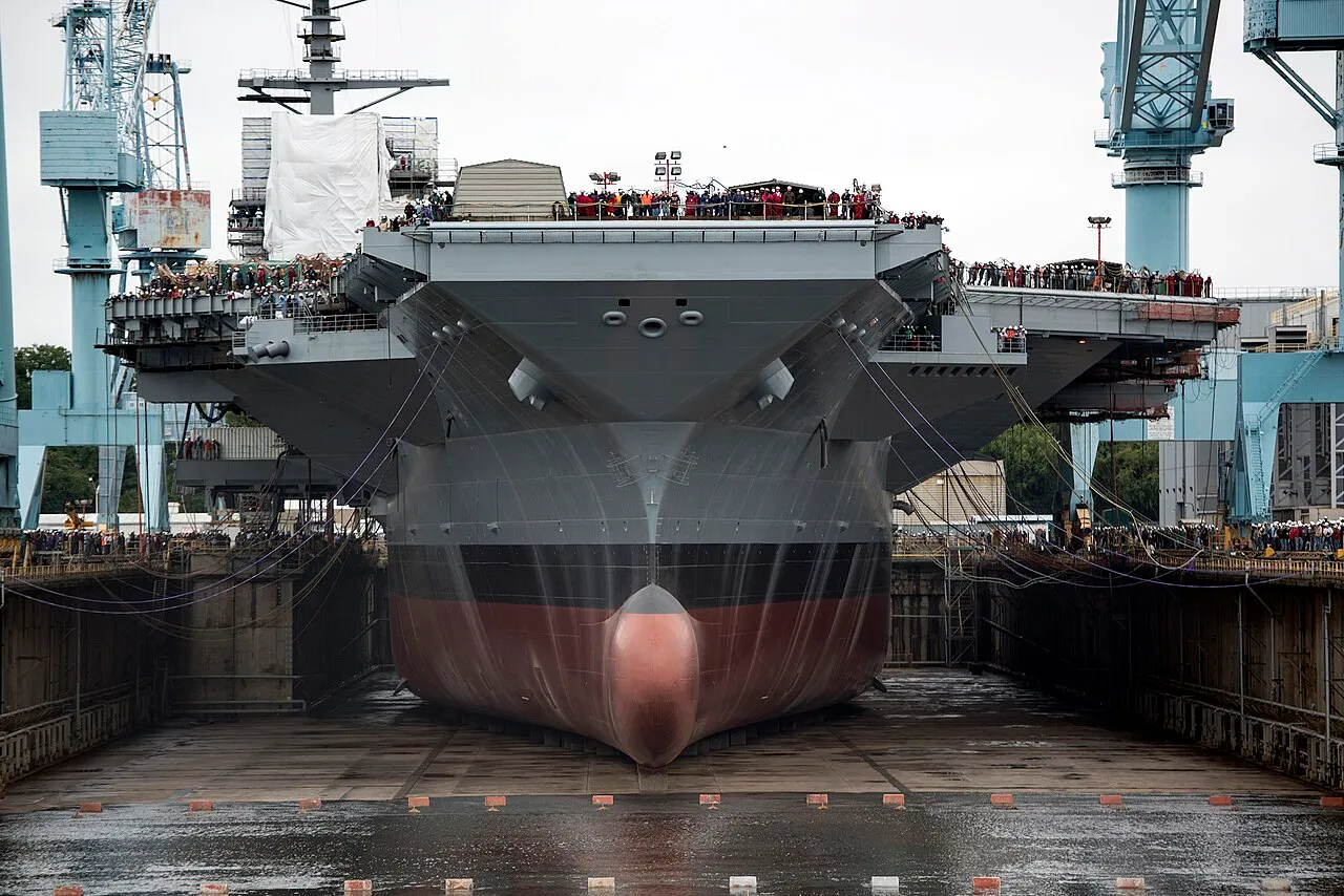 USS Gerald R. Ford in dry dock at Newport News Shipbuilding as the dock is flooded before launch.
